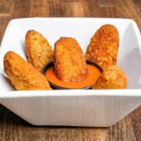 Jalapeno Poppers · Delicious jalapenos battered and deep fried.