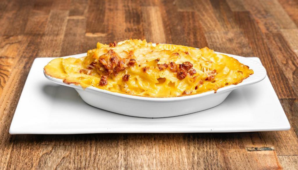 Mac N Cheese With Andouille Sausage · Not your mom's mac n cheese.  Baked mac n cheese with andouille sausage to add a spicy bite.