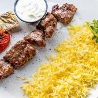 Chenjeh · A skewer of diced lamb marinated in mint yogurt. Served with saffron rice.