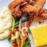 Cajun Fried Chicken · Four southern fried chicken wings served with potato puree, green beans and sweet cornbread ...