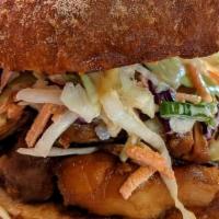 Shoyu Chicken Sandwich · Tender Shoyu Chicken Thigh with Creamy Cabbage & Pineapple Slaw and Spicy Mayo on Toasted Po...