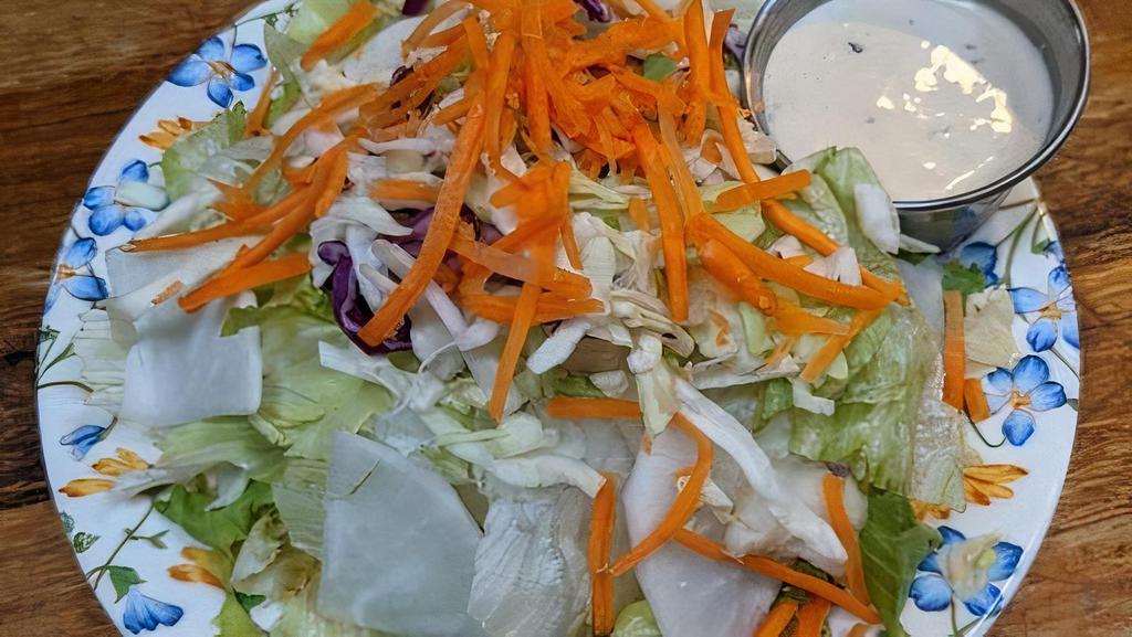 Green Salad · Greens, Cabbage, Carrots, Daikon Radish. Comes with Creamy Sesame Shoyu Dressing. G-F Pineapple Vinaigrette Available.