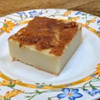 Butter Mochi · Classic Hawaiian Dessert. Sweet Rice Flour, Coconut Milk, Eggs and Butter Baked Into A Delic...