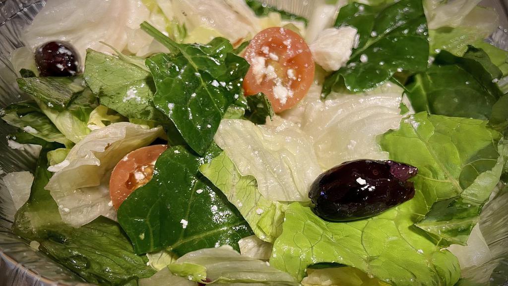 Mediterranean Salad · Fresh mixed greens topped with tomatoes, mediterranean olives, onions, and feta cheese tossed in lemon and olive oil dressing.