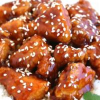 Sesame Chicken / 芝麻鸡 · Chunks of chicken sautéed with sesame seeds in special sauce, mild and delicate.