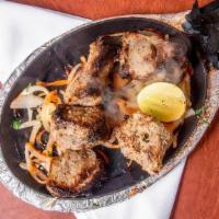 Boti Kebab · Cubes of lamb flavored with ginger and garlic cooked in the tandoor.