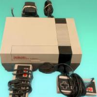 Nintendo Console · Original NES console with power cord, af switch and 2 controllers.