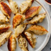 Gyoza (Veggie Or Pork) · Deep-fried dumplings filled with ground pork or vegetables and wrapped in a thin dough