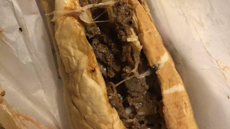 Cheesesteak Wrap · Lettuce, tomatoes, mayo, fried onions, cheese.