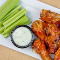 Chicken Wings (8 Pcs)  · 8 pieces of bone-in chicken wings tossed in our homemade buffalo sauce, then baked to perfec...