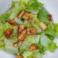 Caesar Salad · Romaine lettuce tossed in creamy Caesar dressing. Topped with Parmesan or Romano cheese and ...