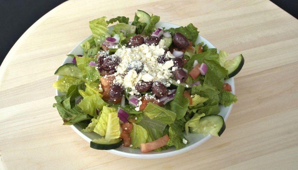 Greek Salad · Tomatoes, green peppers, red onions, Kalamata olives, and chopped romaine lettuce. Topped with feta and our homemade Greek dressing.