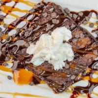 Ghirardelli Brownie · Ghirardelli double-chocolate fudge brownie topped with whipped cream, chocolate syrup, caram...