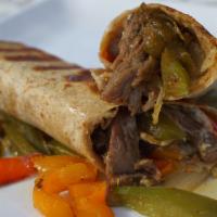 Steak Breakfast Wrap · Shaved Steak, Eggs, (scrambled w/or w/o cheese, served
inside your choice of wrap