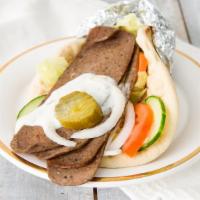Beef Gyro Sandwich · Sliced beef, lettuce, tomatoes, cucumbers, onions, parsley, sliced pickles, all wrapped in p...