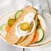 Chicken Gyro · Sliced chicken, lettuce, tomatoes, cucumbers, onions, parsley, sliced pickles, all wrapped i...