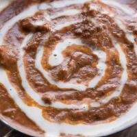 Butter Chicken · Grilled boneless chicken cooked in a tomato cream sauce. Served with rice.