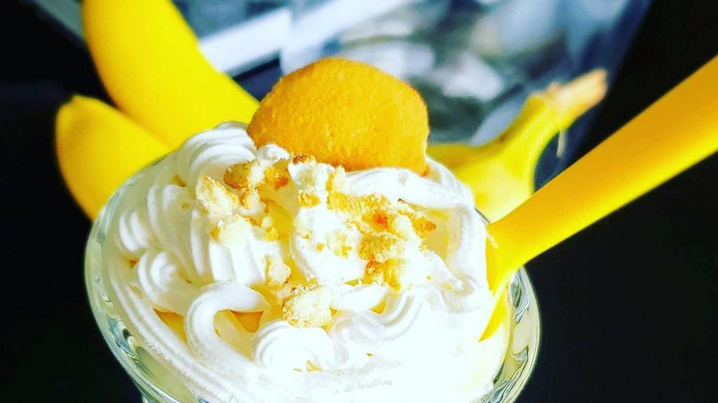 Banana Pudding · Eight ounce serving of creamy banana pudding with vanilla wafers, whipped cream, and our signature cookie crumble topping