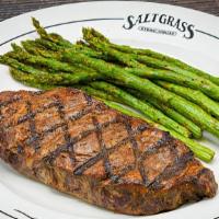 New York Strip · 12 oz. Served with a side & your choice of dinner Caesar salad, dinner salad (with a choice ...