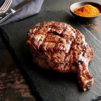 Cowboy Ribeye · 21 oz. Served with a side & your choice of dinner Caesar salad, dinner salad (with a choice ...