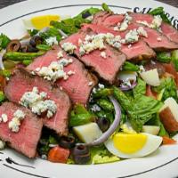 Steak Salad · Center-cut top sirloin, crisp Romaine, red potatoes, eggs, green beans, black olives, onions...