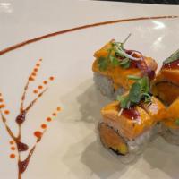 Sunset Roll · Seared salmon on top, inside spicy salmon, mango with ponzu, unagi sauce.