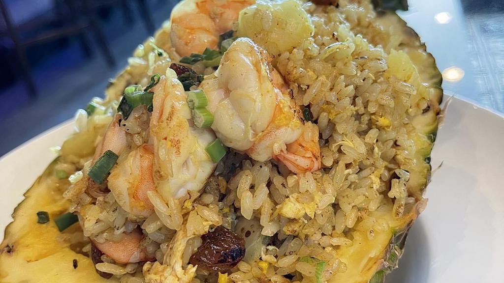 Pineapple Fried Rice · Special fried rice. Curry fried rice with pineapple, shrimp, egg, onion, dried raisin.