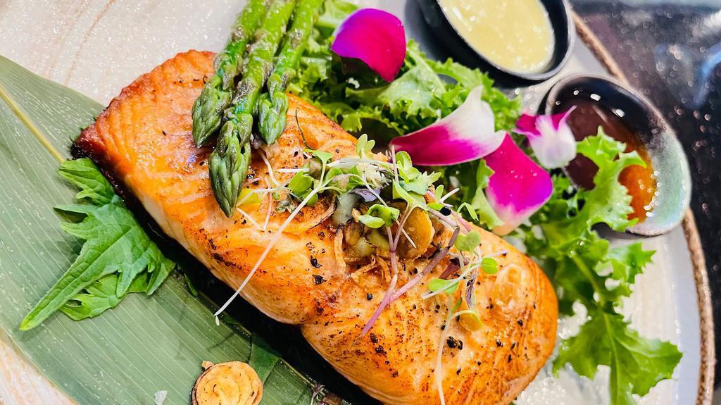 Atlantic Salmon · Grilled salmon with special honey, avocado sauce on the side.