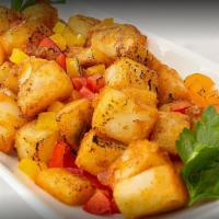 Breakfast Potatoes · Our delicious house breakfast potatoes crispy & stir-fried with bell peppers! Magnifique!