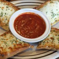 Garlic Bread · Bread topped a butter herb seasoning baked to perfection.