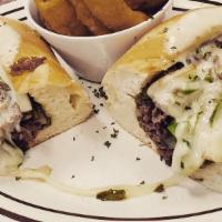 Philly Cheese Steak Sandwich · Onion and peppers.