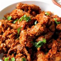 Chicken Suka · Chicken cooked with red chilies, curry leaves, and chef’s choice spices.