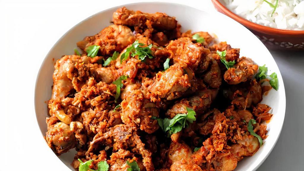 Chicken Suka · Chicken cooked with red chilies, curry leaves, and chef’s choice spices.