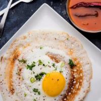 Egg Dosa · Crepe made with Lentil and rice flour batter, Served with chutnies and sambar.