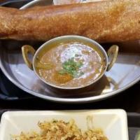 Paper Dosa · Crepe made with Lentil and rice flour batter, Served with chutnies and sambar.