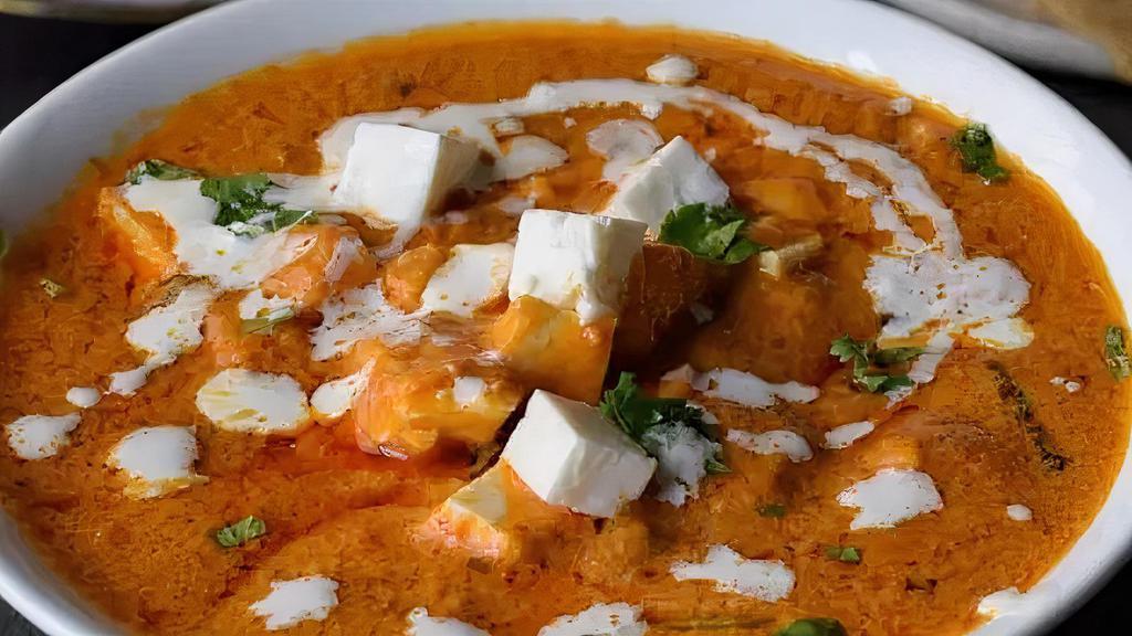 Paneer Butter Masala · Indian cheese with creamy tomato sauce.
