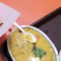 Dal Tadka · Yellow lentils cooked with red chilies.