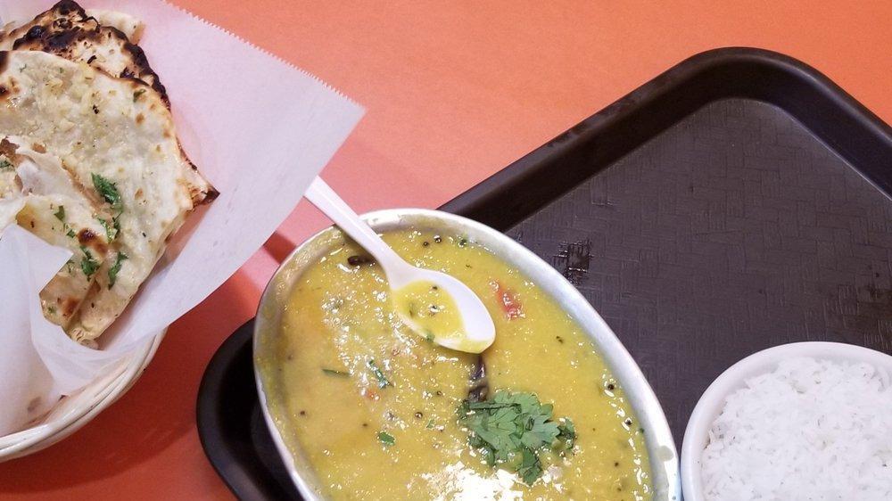 Dal Tadka · Yellow lentils cooked with red chilies.