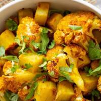 Aloo Gobi · Cauliflower and potatoes cooked with spices, onion, and tomato.