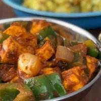 Paneer Kadai · Indian cheese, onion, and peppers cooked with onion-tomatoes.