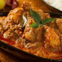 Chicken Chettinad · Bone-in chicken cooked with South Indian spices, black pepper, curry leaves, and onions.