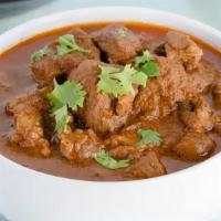 Lamb Curry · Lamb cooked with coriander, onion, and tomatoes.