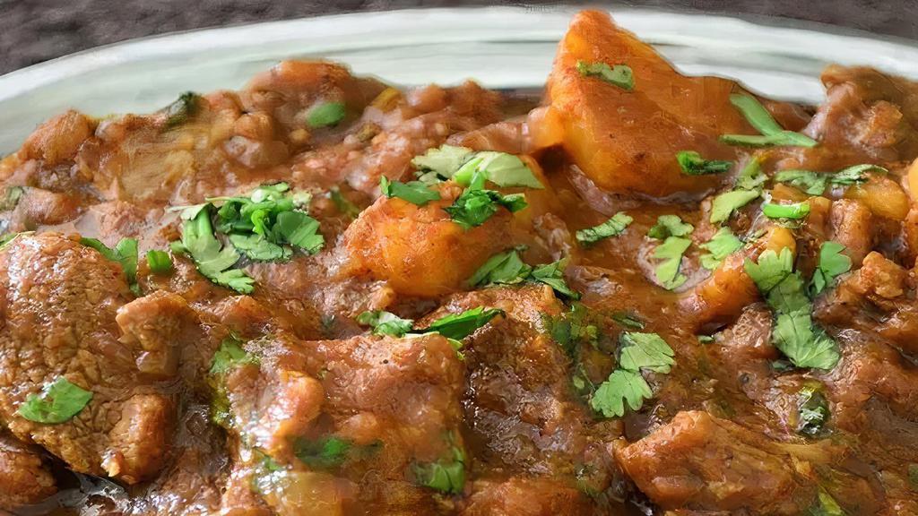 Lamb Vindaloo · A delicious tangy dish made with chef’s special sauce with a touch of vinegar.