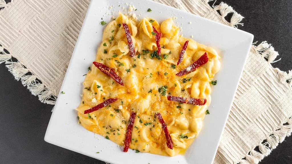 Truffle Mac & Cheese · Add proteins for an additional charge.