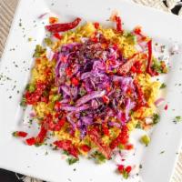 Sautéed Purple Cabbage · Red and green pepper and onions top with flavorful yellow rice.