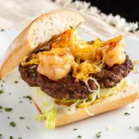 Gourmet Shrimp Filled Cheeseburger (8 Oz.) · Angus Beef burger top with sautéed blackened shrimp, lettuce, tomatoes, cheese, and tarragon...