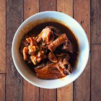 Pollo Guisado · Chicken stew.