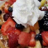 Ahhh Suzette · Waffle loaded with fresh fruit and whipped cream.