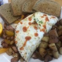 Patts · Home made corned beef hash topped with 2 eggs your choice, spuds, and toast.