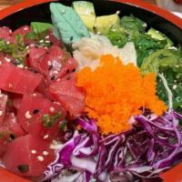 Tuna Poke · Raw tuna marinated with our chef’s special sauce served on sushi rice with seaweed salad, cu...